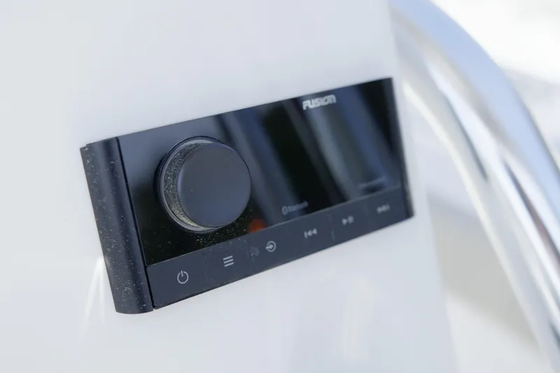 Slide: The Image of Close-up of a Fusion audio control panel on a 2026 Key West 203 FS boat. - 26
