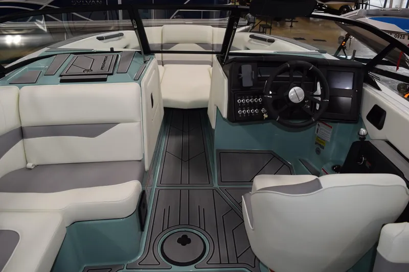 Slide: The Image of 2025 Moomba Mojo boat interior with modern dashboard and seating. - 11