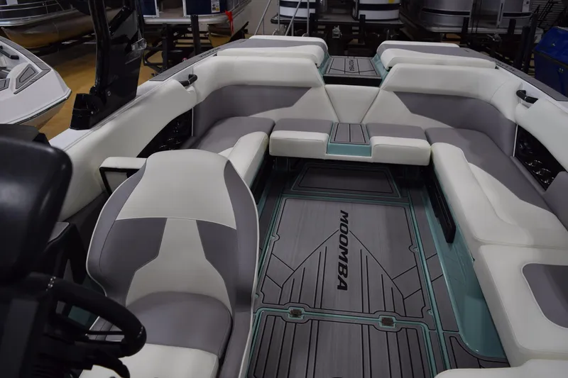 Slide: The Image of 2025 Moomba Mojo boat interior with spacious seating and modern design. - 19