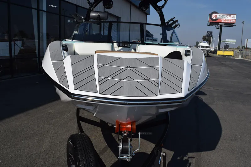 Slide: The Image of 2025 Moomba Mojo boat on trailer, featuring sleek design and modern detailing. - 2