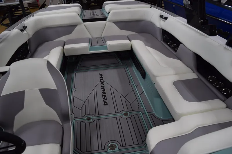 Slide: The Image of 2025 Moomba Mojo boat interior with spacious seating and stylish design. - 20
