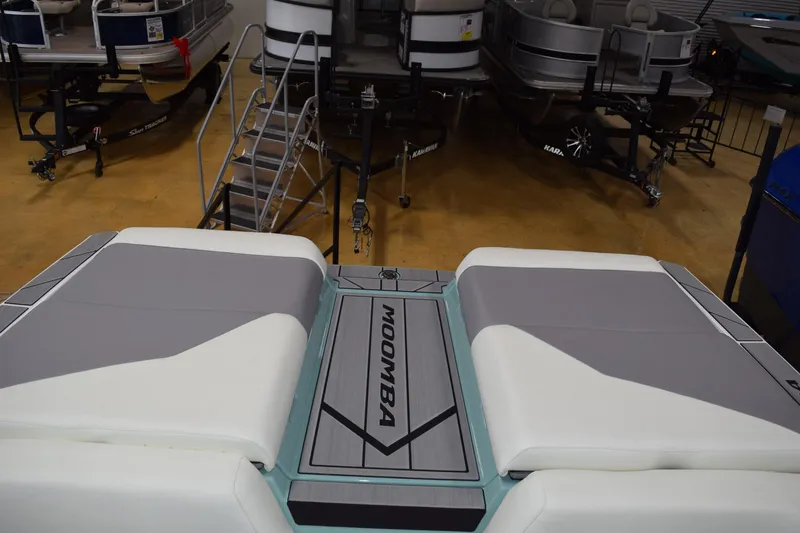 Slide: The Image of 2025 Moomba Mojo boat interior with sleek seating and modern design. - 21