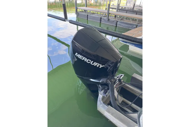 Slide: The Image of Mercury outboard motor on 2023 Godfrey SWEETWATER 2486 DT pontoon boat at dock. - 4