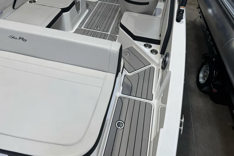 Slide: The Image of 2026 Sea Ray SPX 210 boat interior with sleek seating and modern design. - 10