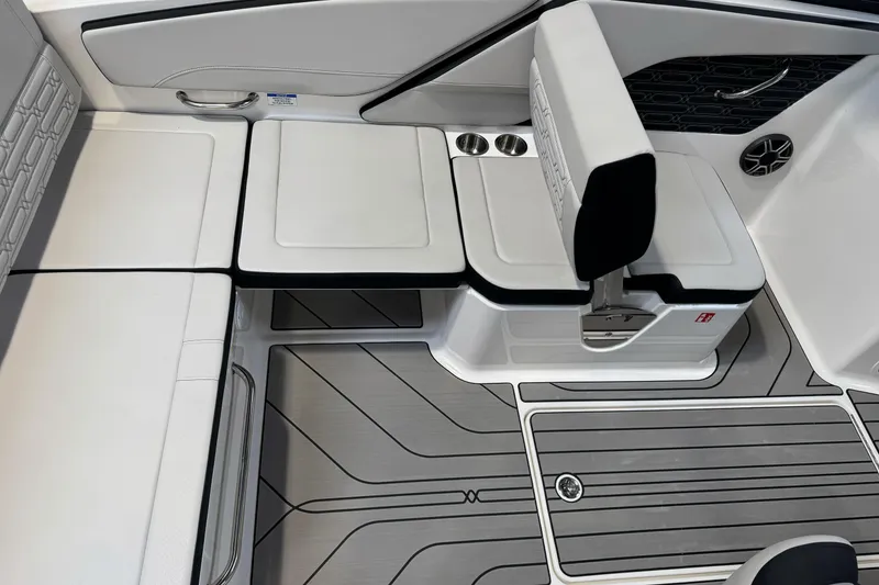 Slide: The Image of 2026 Sea Ray SPX 210 boat interior with sleek seating and modern design. - 13