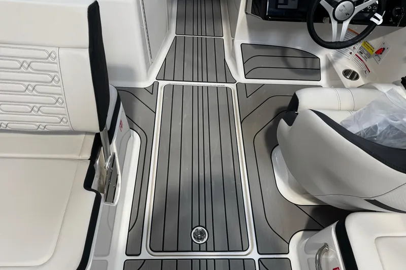 Slide: The Image of Interior of 2026 Sea Ray SPX 210 boat with sleek seating and modern flooring. - 23