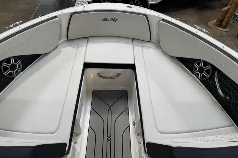 Slide: The Image of 2026 Sea Ray SPX 210 boat interior with white seating and modern design. - 30