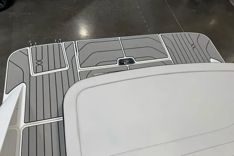 Slide: The Image of 2026 Sea Ray SPX 210 boat deck with sleek, modern design and gray non-slip surface. - 7