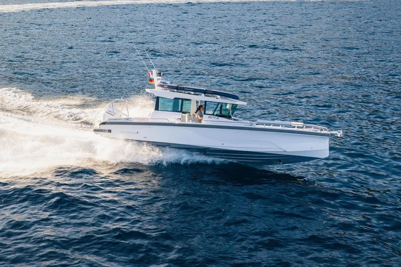 The Image of 2026 Axopar 29 XC cruising on scenic coastal waters. - 0