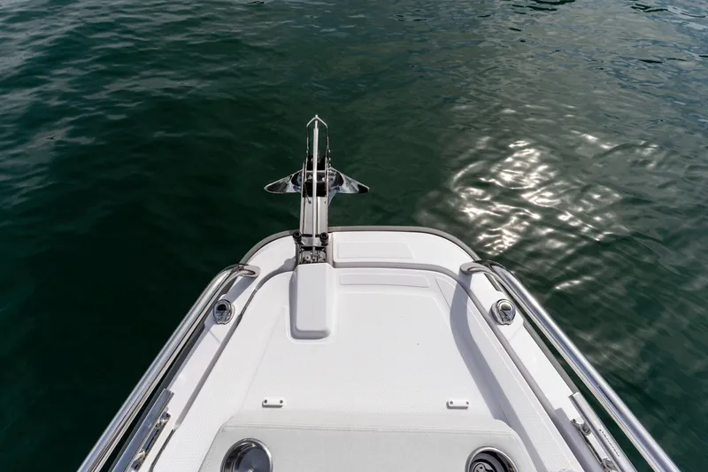 Slide: The Image of Bow of 2026 Axopar 29 XC Cross Cabin on calm water. - 24