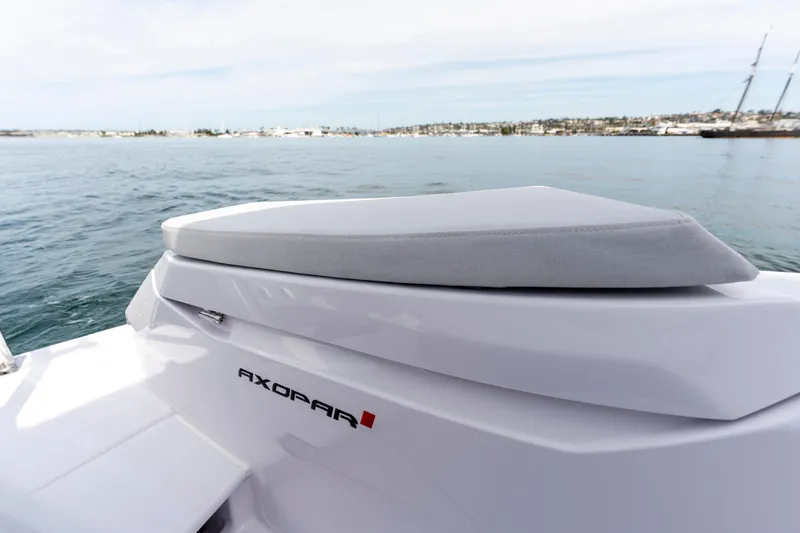 Slide: The Image of 2026 Axopar 29 XC Cross Cabin boat on calm water, showcasing sleek design. - 25