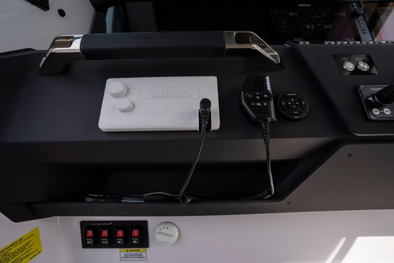 Slide: The Image of Control panel of 2026 Axopar 29 XC Cross Cabin with Simrad equipment. - 52