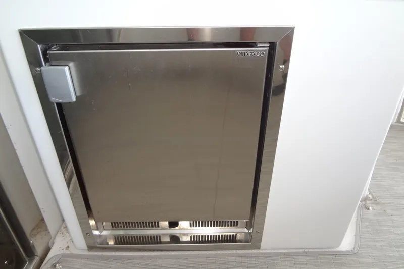 Slide: The Image of Stainless steel refrigerator on 2021 Cruisers Yachts 50 Cantius boat. - 11