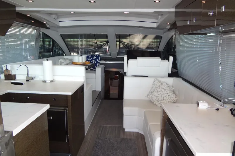 Slide: The Image of Luxurious interior of 2021 Cruisers Yachts 50 Cantius with modern kitchen and seating area. - 13