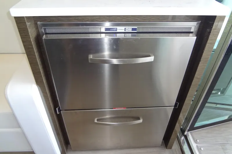 Slide: The Image of Stainless steel drawer refrigerator in 2021 Cruisers Yachts 50 Cantius galley. - 18
