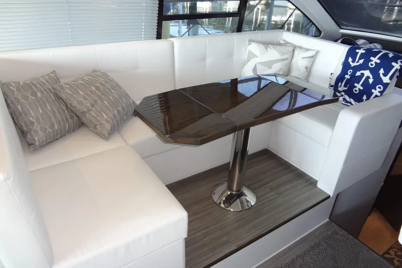 Slide: The Image of Luxurious interior of 2021 Cruisers Yachts 50 Cantius with elegant seating and modern table design. - 23