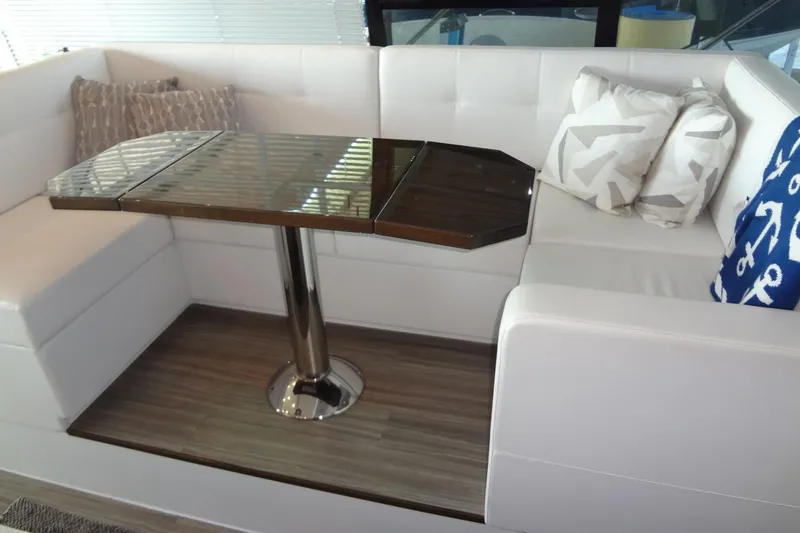Slide: The Image of Luxurious 2021 Cruisers Yachts 50 Cantius interior with elegant seating and modern table design. - 24