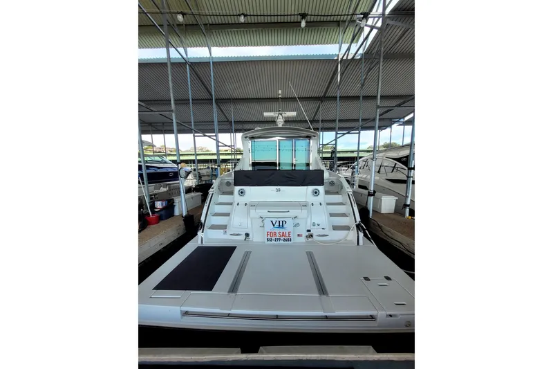 Slide: The Image of 2021 Cruisers Yachts 50 Cantius for sale, docked in a covered marina. - 3