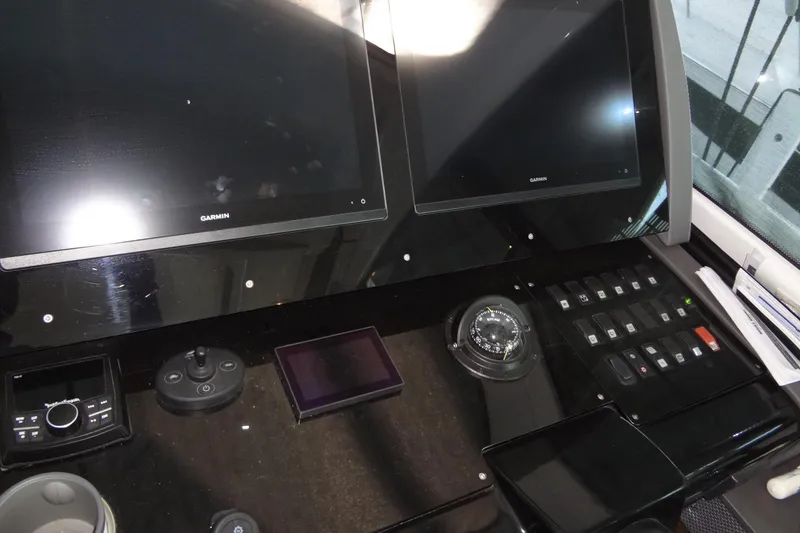 Slide: The Image of Control panel of 2021 Cruisers Yachts 50 Cantius with Garmin displays and navigation instruments. - 30