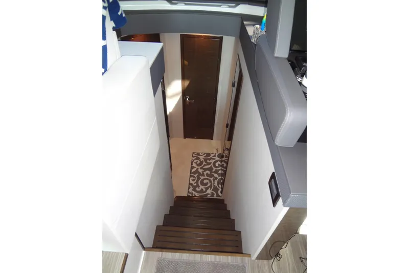 Slide: The Image of Interior staircase of 2021 Cruisers Yachts 50 Cantius, featuring modern design and elegant decor. - 35