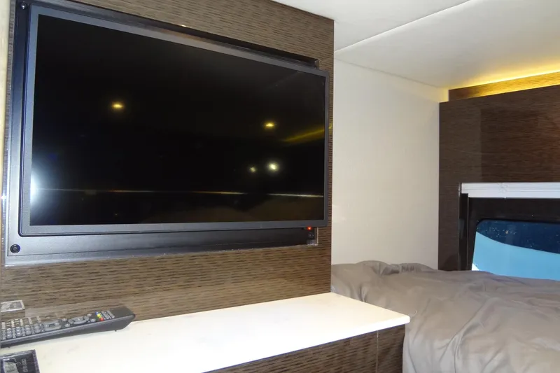 Slide: The Image of Interior of 2021 Cruisers Yachts 50 Cantius with TV and bed. - 37