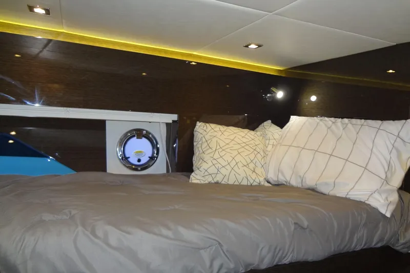 Slide: The Image of Luxurious cabin interior of 2021 Cruisers Yachts 50 Cantius with cozy bedding. - 38