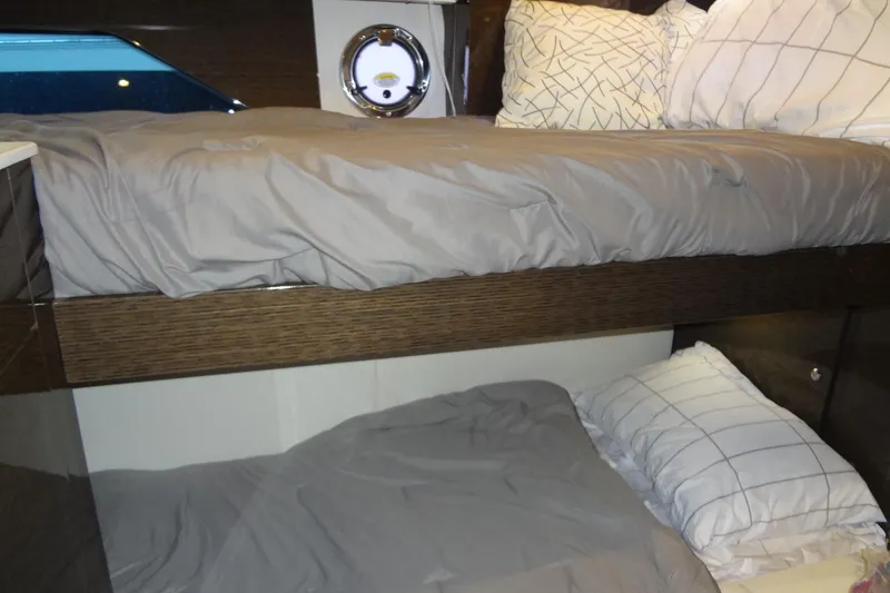 Slide: The Image of Bunk beds in 2021 Cruisers Yachts 50 Cantius cabin with modern bedding. - 39
