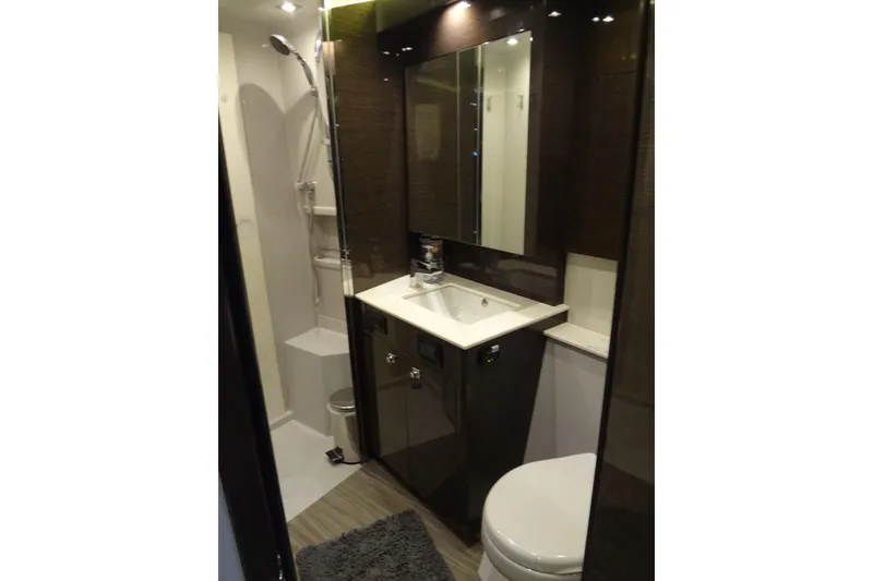 Slide: The Image of Luxurious bathroom in 2021 Cruisers Yachts 50 Cantius with modern fixtures and elegant design. - 44