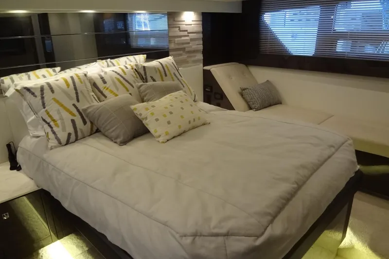 Slide: The Image of Luxurious bedroom interior of 2021 Cruisers Yachts 50 Cantius with modern decor and plush bedding. - 46