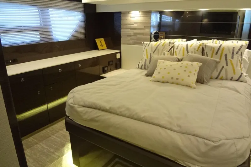 Slide: The Image of Luxurious bedroom interior of 2021 Cruisers Yachts 50 Cantius with modern decor and plush bedding. - 47