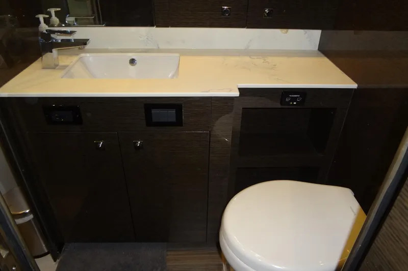 Slide: The Image of Modern bathroom in 2021 Cruisers Yachts 50 Cantius with sink and toilet. - 51