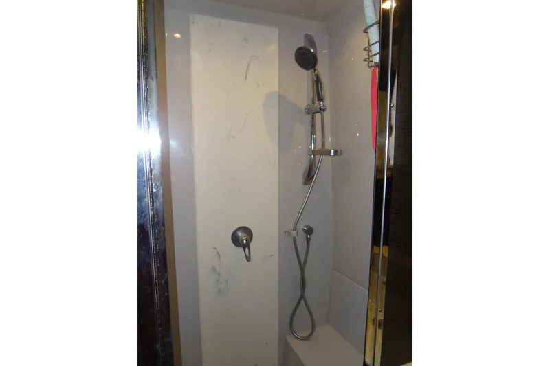 Slide: The Image of Shower area in 2021 Cruisers Yachts 50 Cantius, featuring modern fixtures and sleek design. - 52