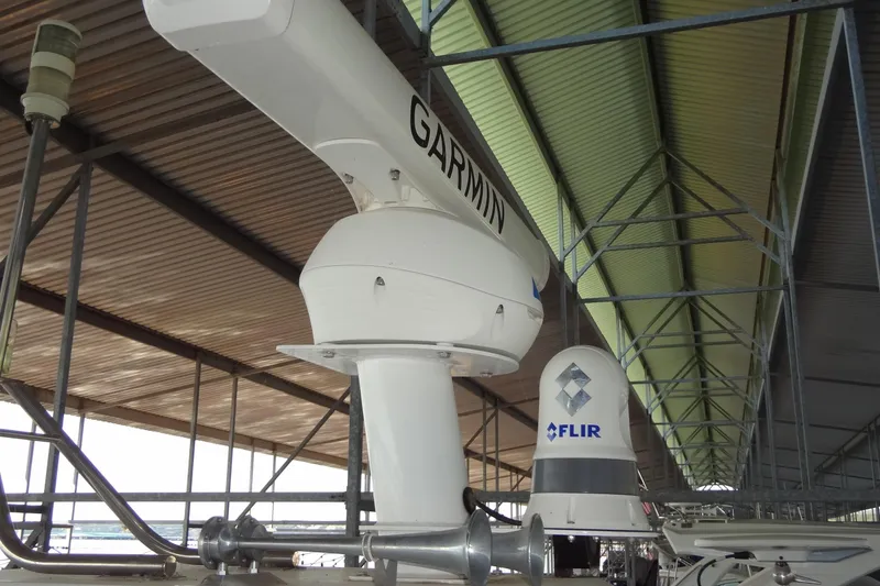 Slide: The Image of Radar and FLIR systems on 2021 Cruisers Yachts 50 Cantius under a metal roof. - 54