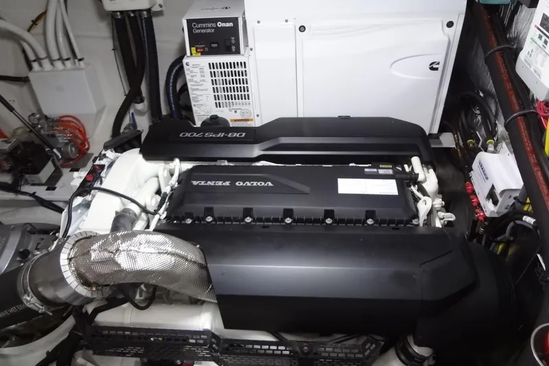 Slide: The Image of Engine room of 2021 Cruisers Yachts 50 Cantius with Volvo Penta and Cummins Onan generator. - 55