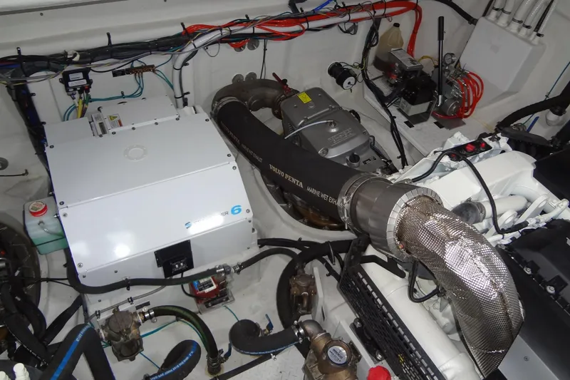 Slide: The Image of Engine room of 2021 Cruisers Yachts 50 Cantius, showcasing mechanical components and wiring. - 57