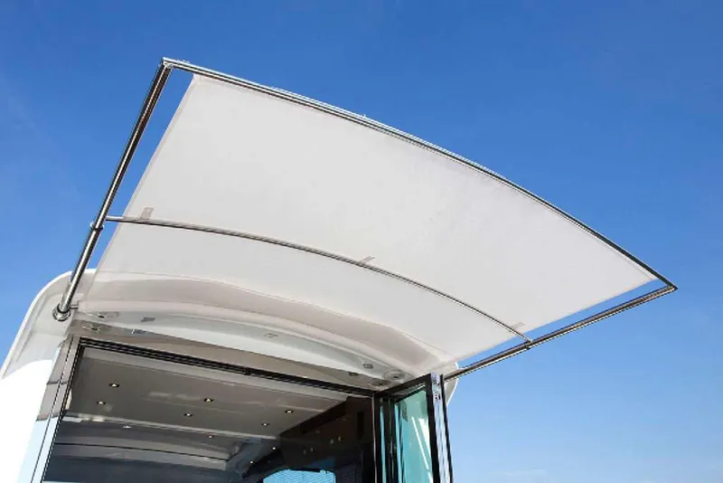 Slide: The Image of Manufacturer Provided Image: 2021 Cruisers Yachts 50 Cantius sunshade against clear blue sky. - 6