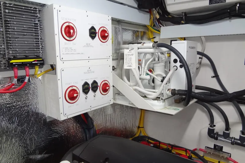 Slide: The Image of Engine room of 2021 Cruisers Yachts 50 Cantius with battery switches and wiring. - 61