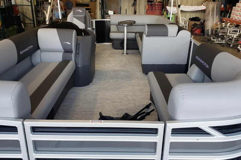 Slide: The Image of 2026 Bennington 20SL pontoon boat interior with gray seating and modern design. - 15