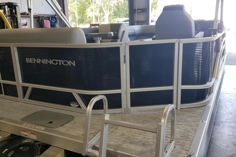 Slide: The Image of 2026 Bennington 20SL pontoon boat interior with gray seating and modern design. - 5