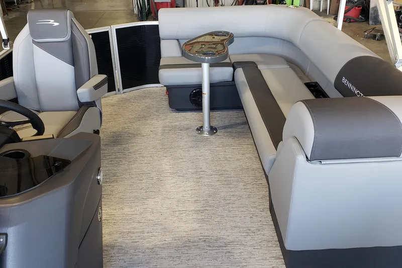 Slide: The Image of 2026 Bennington 20SL boat interior with steering wheel and dashboard controls. - 6