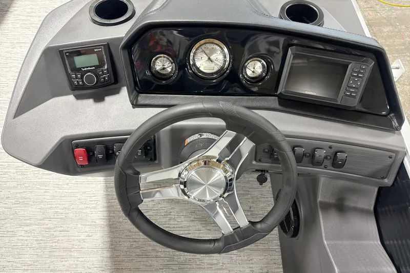 Slide: The Image of 2026 Bennington 20SL boat dashboard with steering wheel, gauges, and control panel. - 9