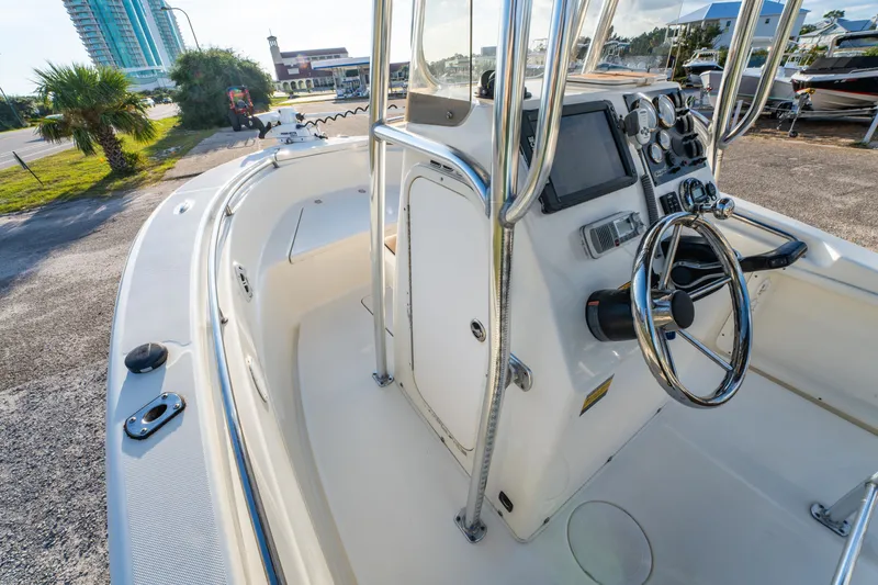 Slide: The Image of 2019 Bulls Bay 200 CC boat interior with steering wheel and control panel. - 15