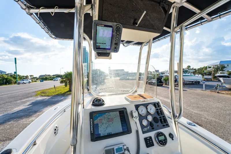 Slide: The Image of 2019 Bulls Bay 200 CC boat dashboard with navigation equipment and gauges. - 17