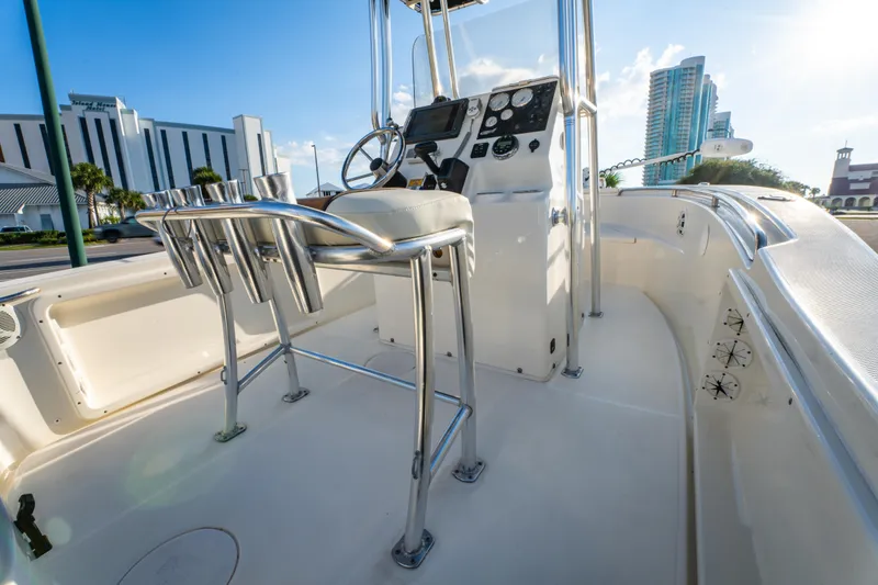 Slide: The Image of 2019 Bulls Bay 200 CC boat interior with steering console and rod holders. - 20