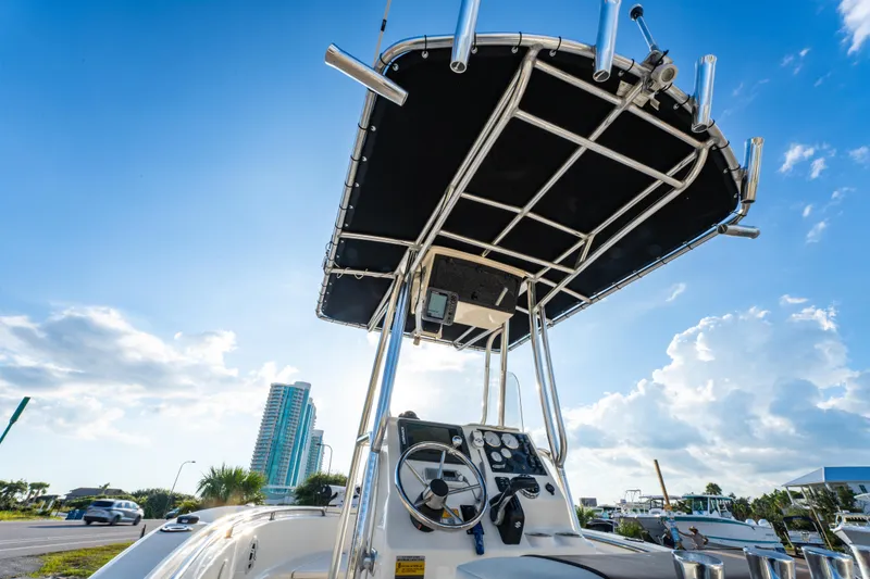 Slide: The Image of 2019 Bulls Bay 200 CC boat with T-top against a clear blue sky. - 26