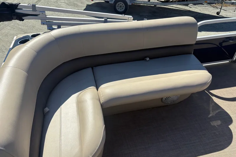 Slide: The Image of 2022 Sun Tracker Bass Buggy 16 XL boat seating with beige upholstery and cup holders. - 8