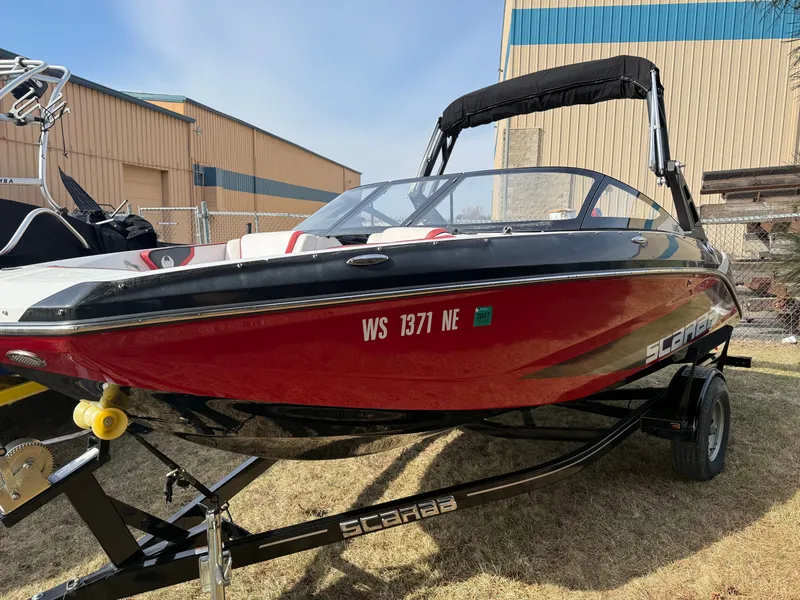 The Image of 2021 Scarab 195 ID boat on trailer, red design. - 0