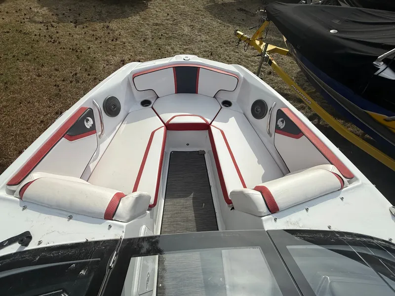 Slide: The Image of Interior of a 2021 Scarab 195 ID boat with red accents. - 10