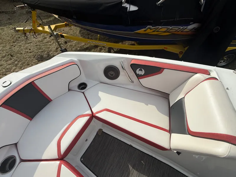 Slide: The Image of Interior of a 2021 Scarab 195 ID boat with red accents. - 12