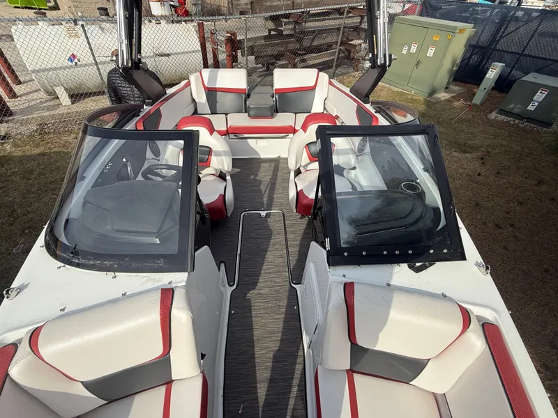 Slide: The Image of Interior view of a 2021 Scarab 195 ID boat with red accents. - 13
